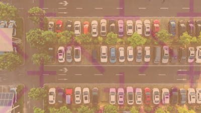 cars parked with translucent crosses overlaying on top of the image